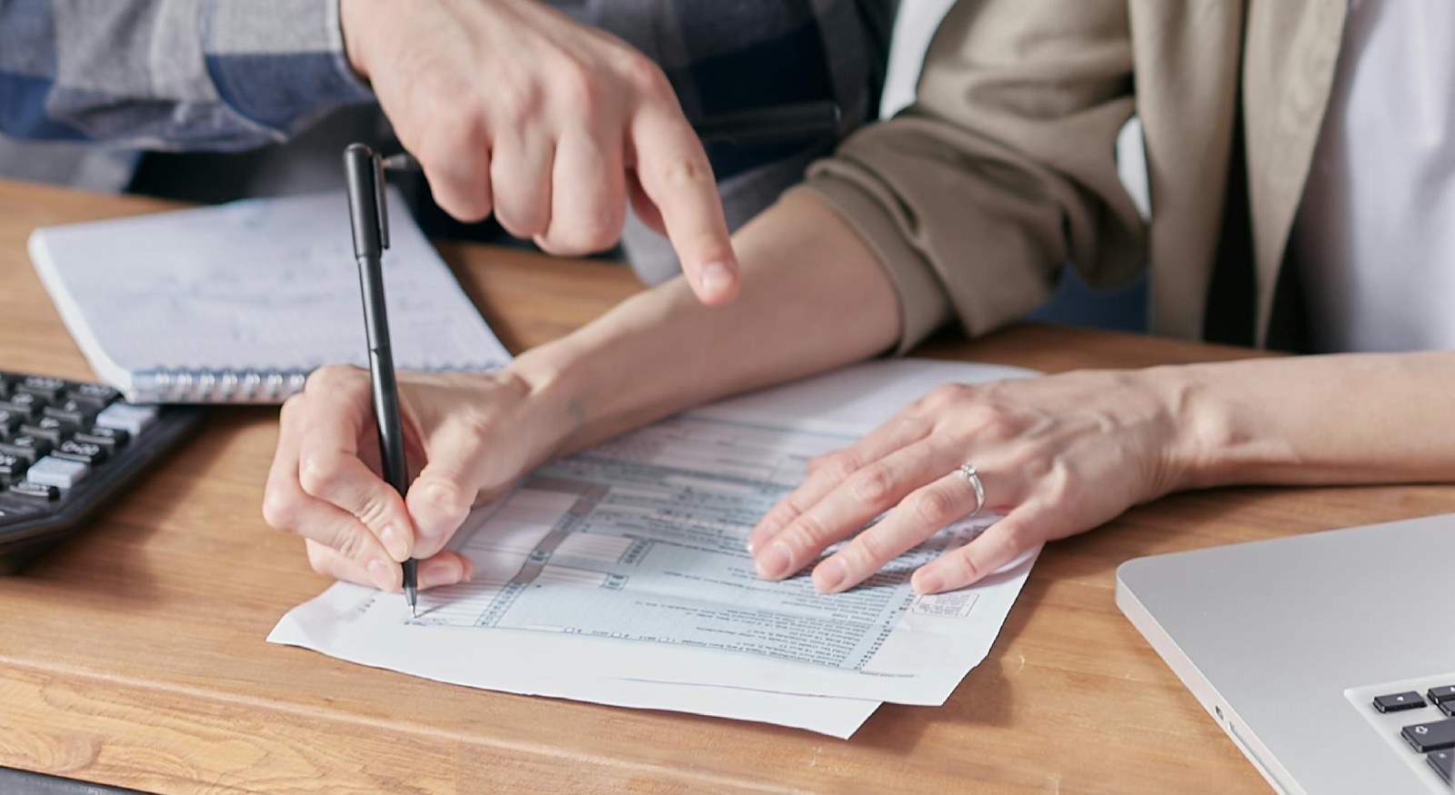 Two people checking their restoration estimate.