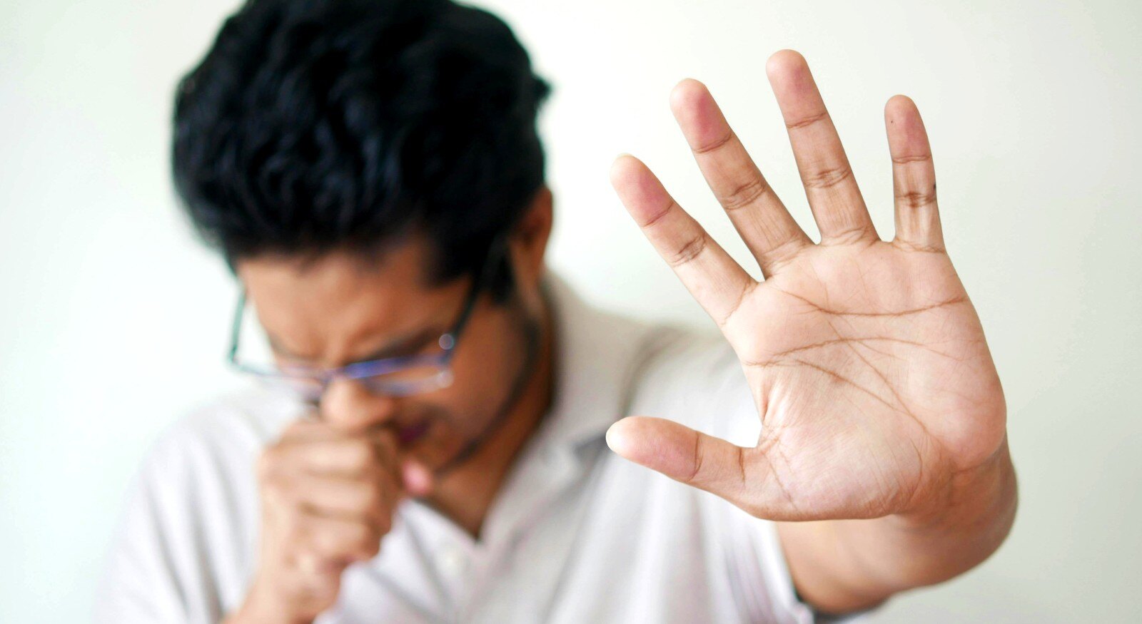 A person coughing.