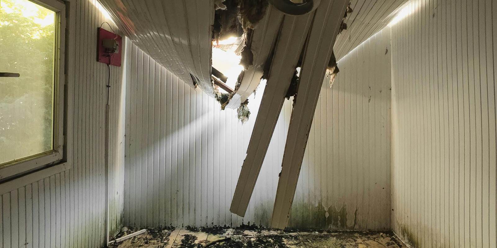 A collapsed ceiling in a damaged home.