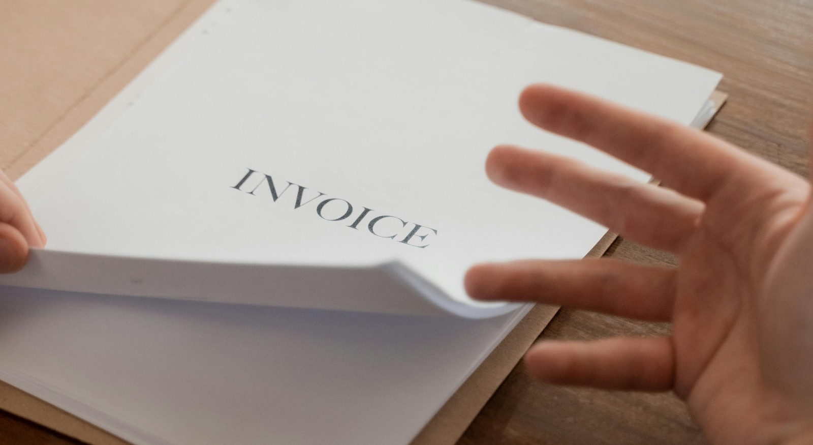 A person reading their invoice